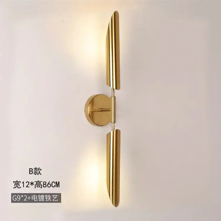 Modern golden inclined tube wall light with gold finish and sleek vertical arms for stylish living room decorbites wall light