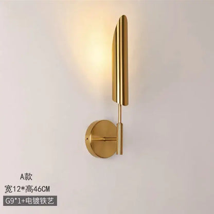 Modern golden inclined tube wall light with gold finish vertical ridges and circular base for living room decorbites golden inclined