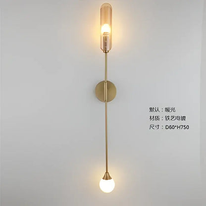 Modern golden inclined tube wall light with gold-toned stem and amber and white glass shades for living room decorbites golden inclined wall light