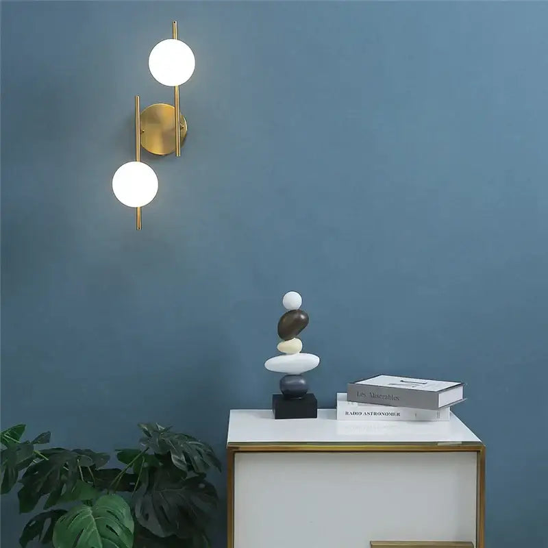 Modern decorbites golden indoor wall sconce with two white glass spheres for elegant indoor wall lights decor