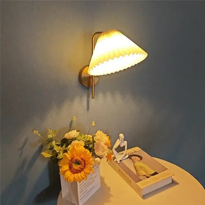 Warm-toned brass wall lamp with pleated glowing lampshade for modern golden led reading bedroom decorbites golden led spotlight