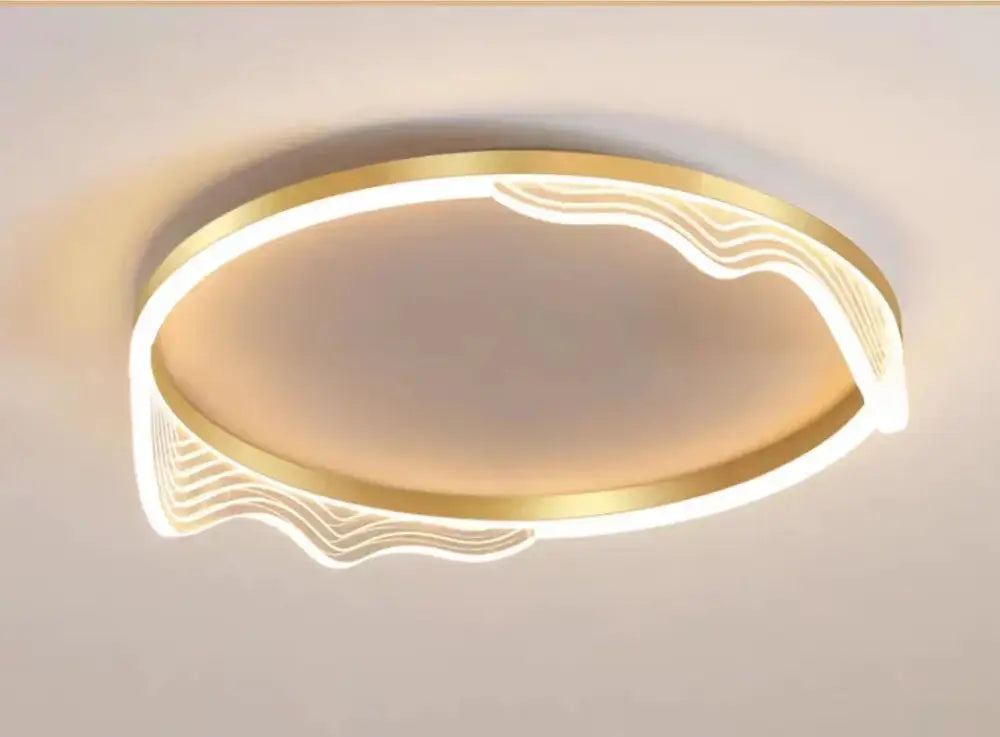 Modern golden lustre ceiling lamp with a wavy design and integrated warm LED lighting for bedroom decorbites golden lustre
