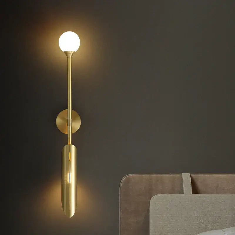 Modern golden metal led wall lamps featuring a gold-toned wall sconce with frosted glass globe for bedroom decorbites decor