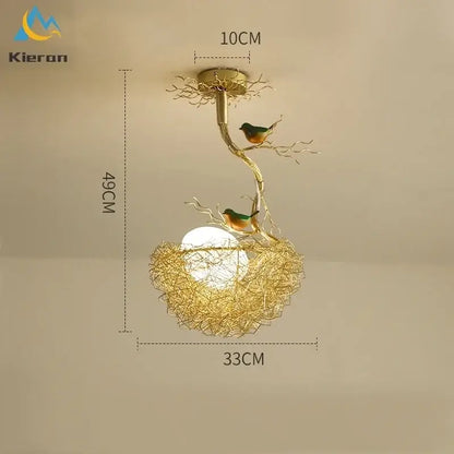 Gold-toned metal ceiling lamp with intricate branch design and two green and orange birds for living room decor