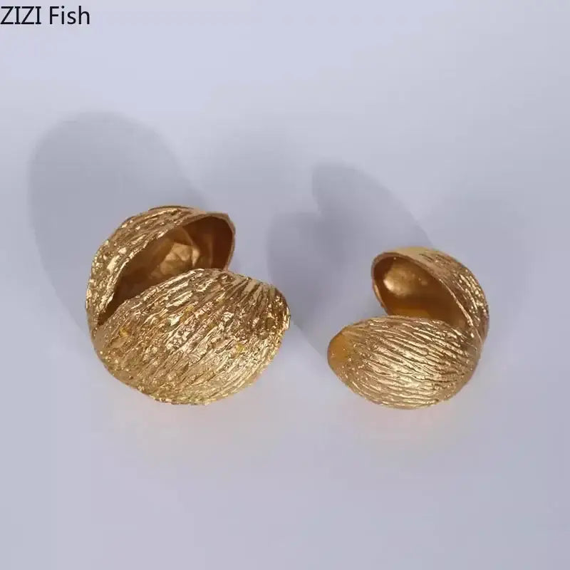 Modern golden nut shell ornaments desk decor featuring textured golden nut shell metallic finish earrings