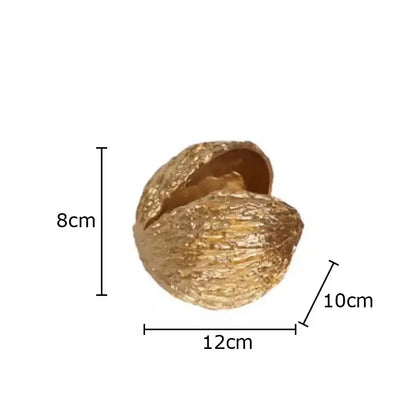 Modern golden nut shell ornaments desk decor featuring a textured, split top resin golden nut shell surface