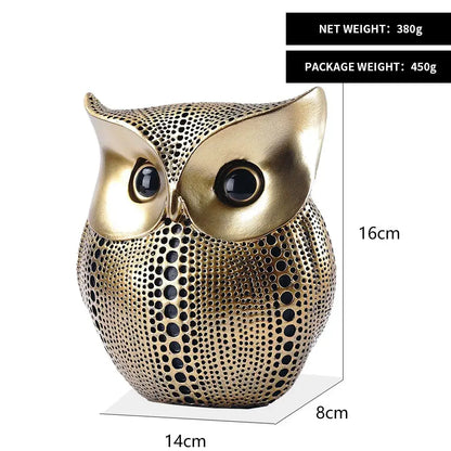 Modern golden perforated owl figurines with glossy black eyes serve as elegant animal statues for living room decorbites golden owl