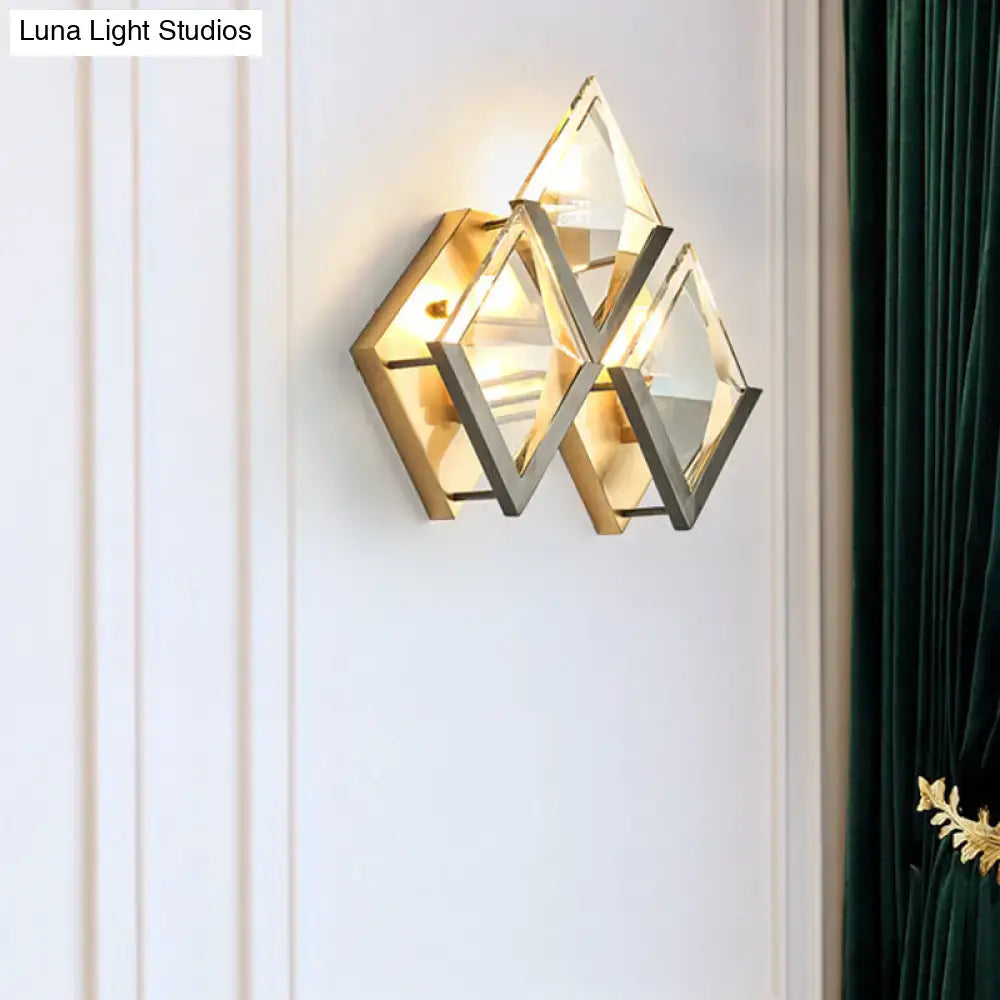 Modern style wall sconce light with gold and silver metallic frames and clear crystal faceted glass panels for bedroom use
