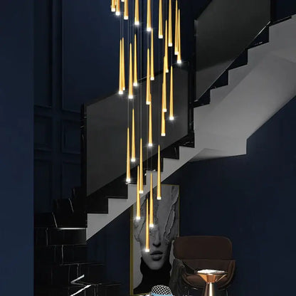 Modern golden tapered led chandelier with cylindrical pendant lights in a cascading arrangement for living room decorbites golden tapered