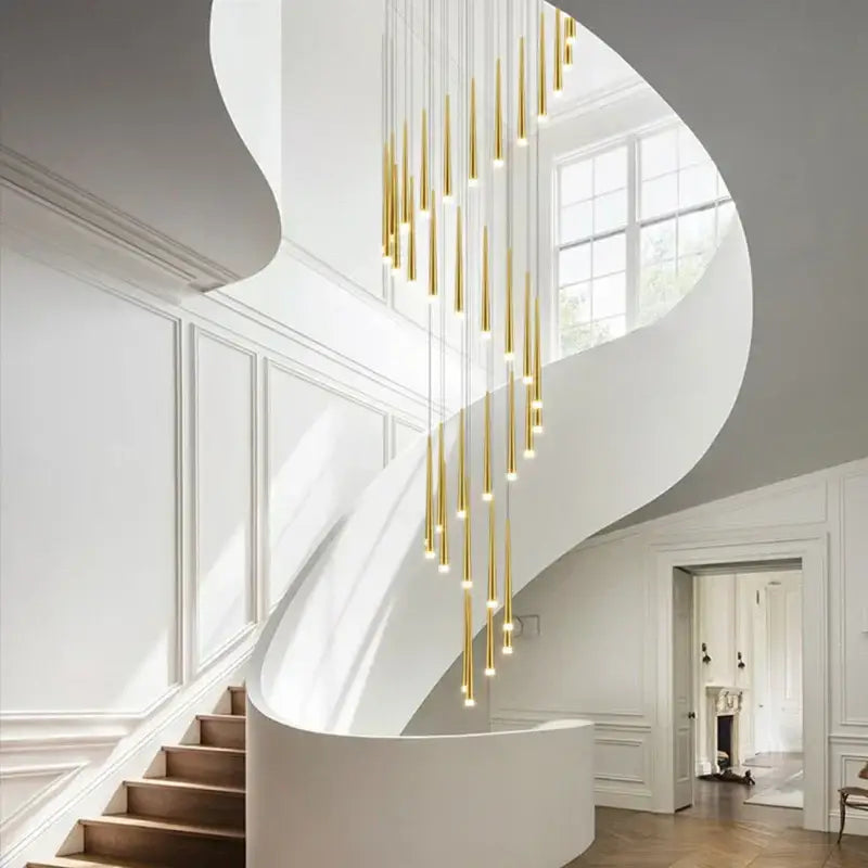 Modern golden tapered led chandelier with cylindrical pendant lights in a cascading arrangement for living room decorbites golden tapered