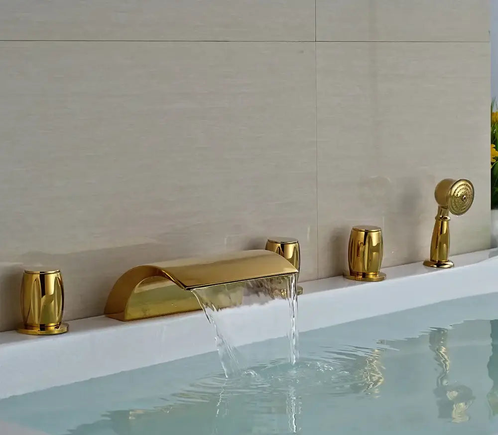 Modern golden widespread brass bathtub faucet with matching cylindrical handles and handheld showerhead for bathroom use