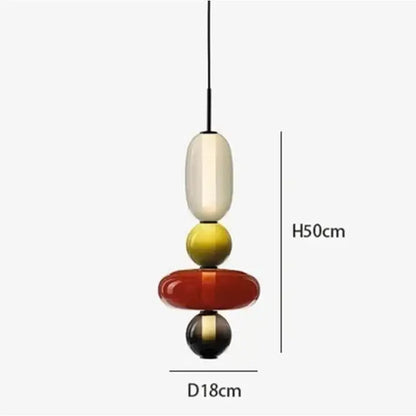 Modern gradient glass pendant light with stacked cream, yellow, red, and black orbs and sleek black cord for dining room