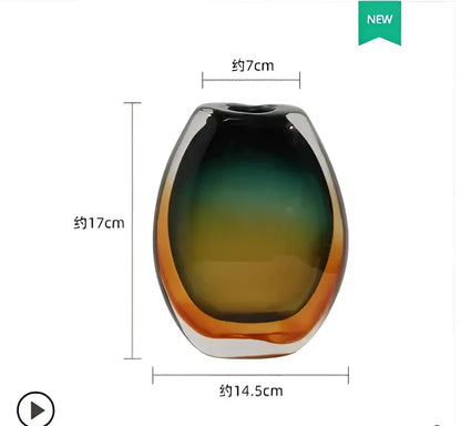 A sleek oval-shaped decorbites gradient glass vase with green to amber finish for modern living room decor