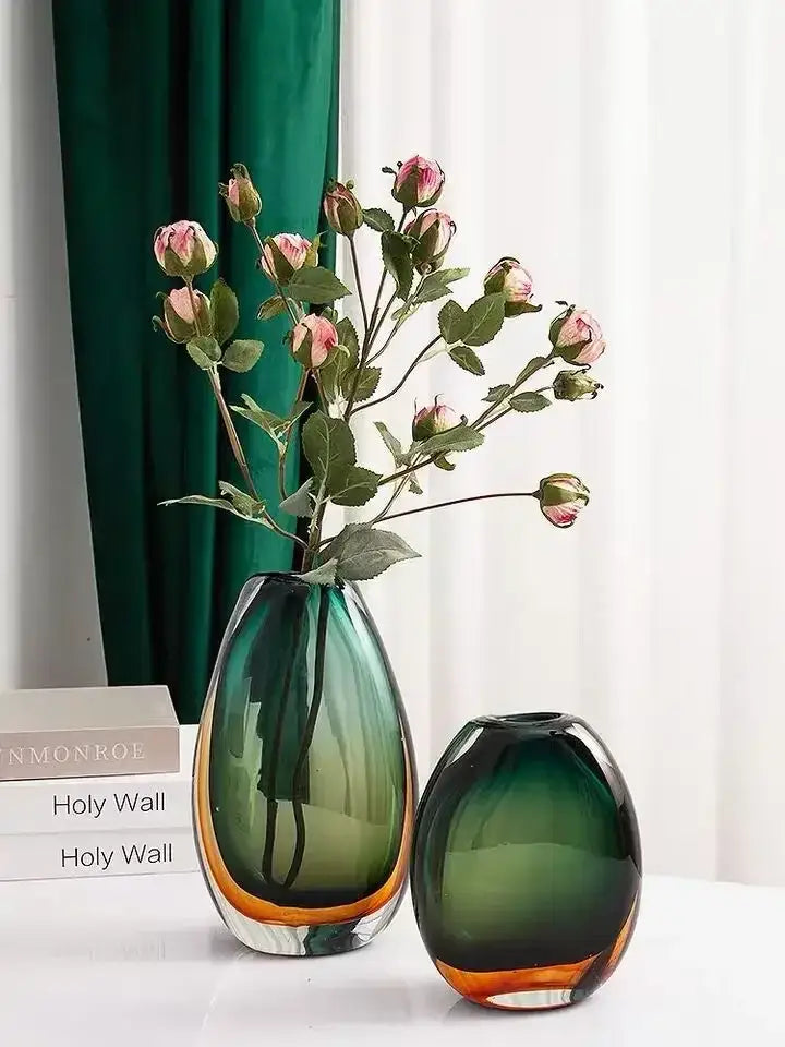 A sleek decorbites gradient glass vase with deep green to amber base and smooth rounded contours for living room decor