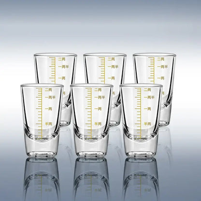 Clear glass spirit set brandy cups with gold-colored chinese measurement markings for modern dining use