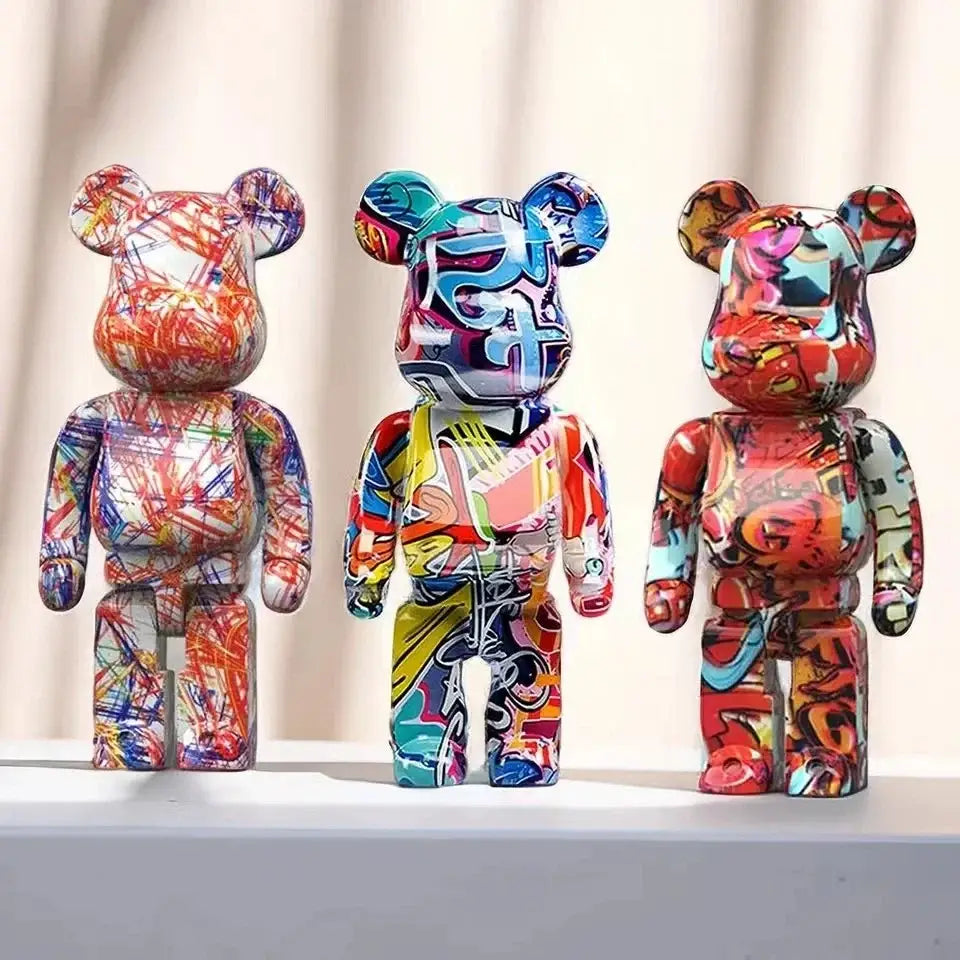 Three vibrant decorbites graffiti bear 27cm figurines with colorful abstract designs and glossy plastic finish money jars