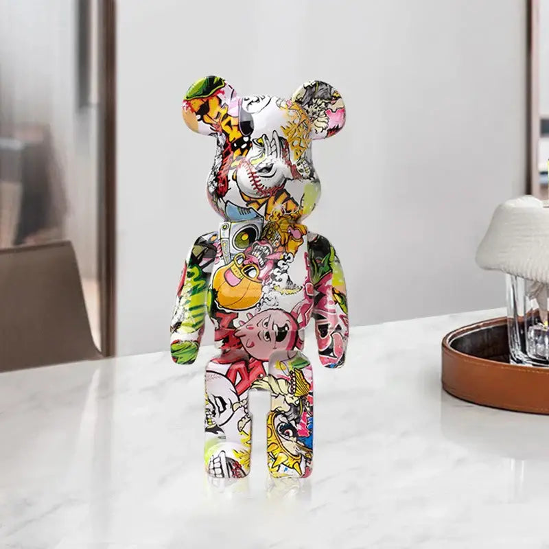 A vibrant glossy vinyl decorbites graffiti bear 27cm figurine with colorful comic graphics used as a living room money jar