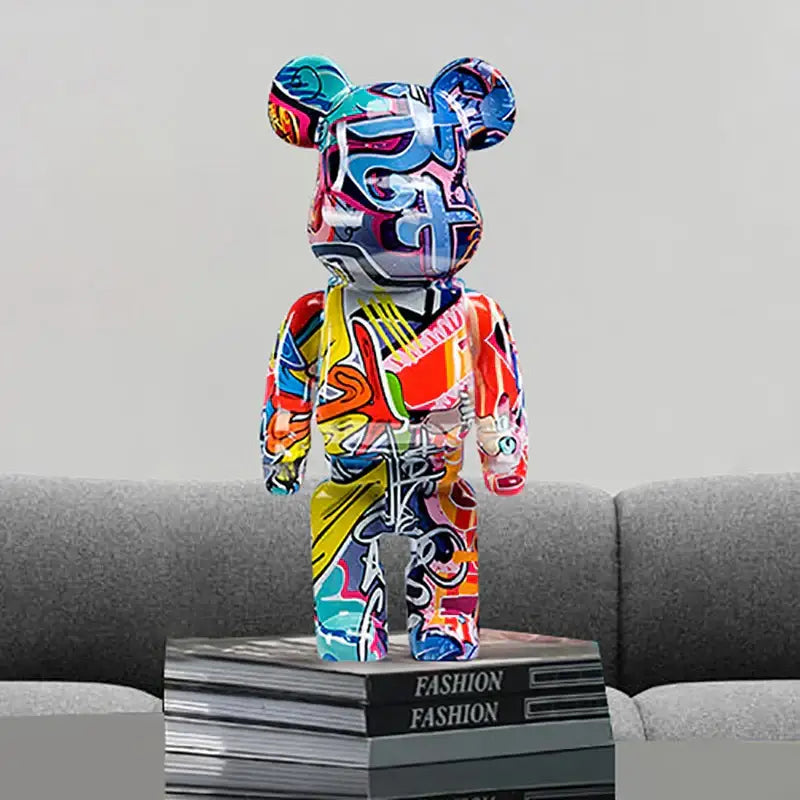 A vibrant decorbites graffiti bear 27cm figurine with glossy colorful graffiti art in blues reds yellows and purples for living room decor