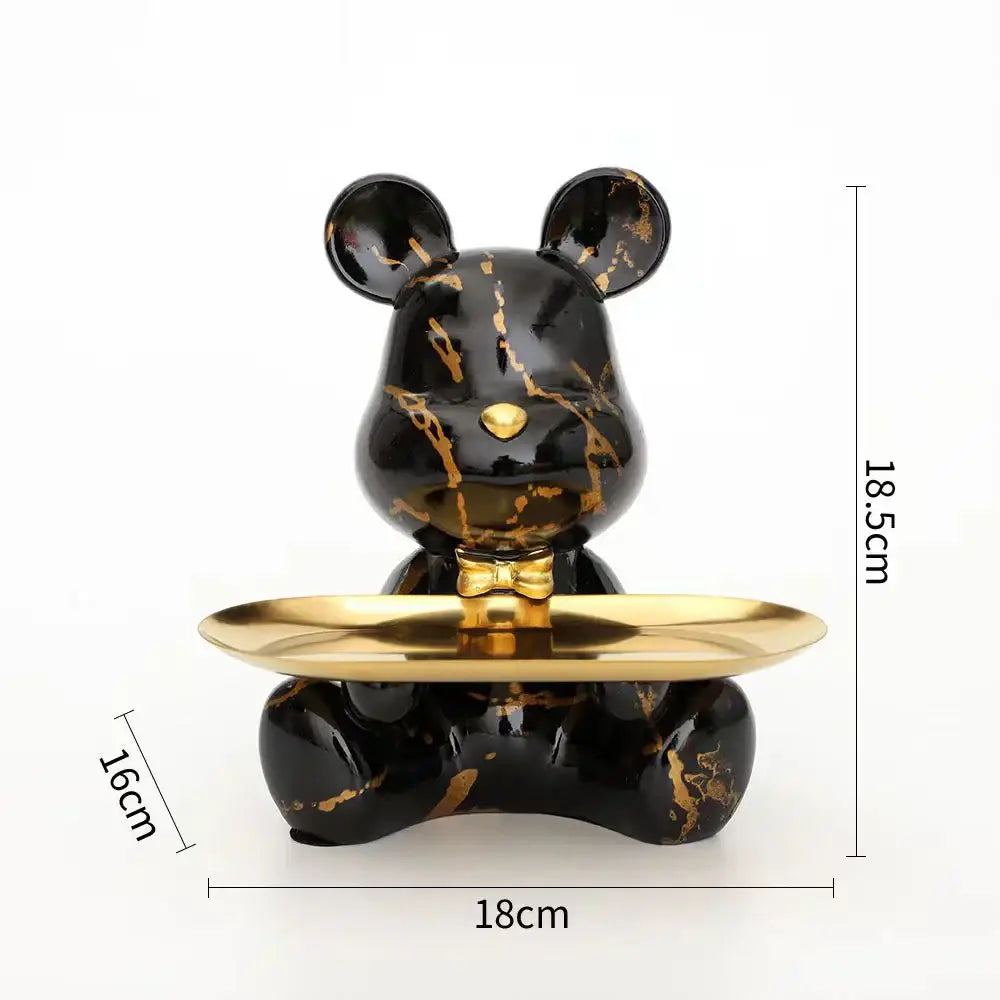 Modern graffiti bear figurine with black bear-shaped decorative tray featuring gold marble veining and polished brass plate