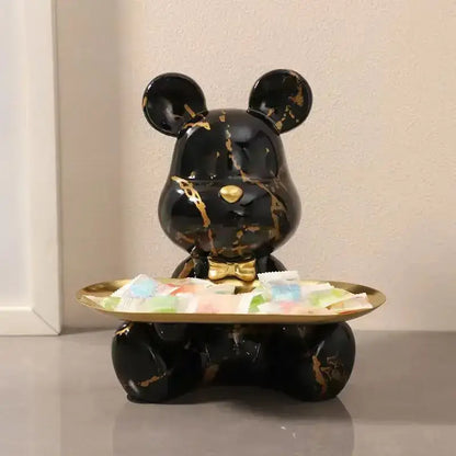 Black marble-effect bear figurine with gold veining and golden bow tie holding brass tray for living room decorbites graffiti bear