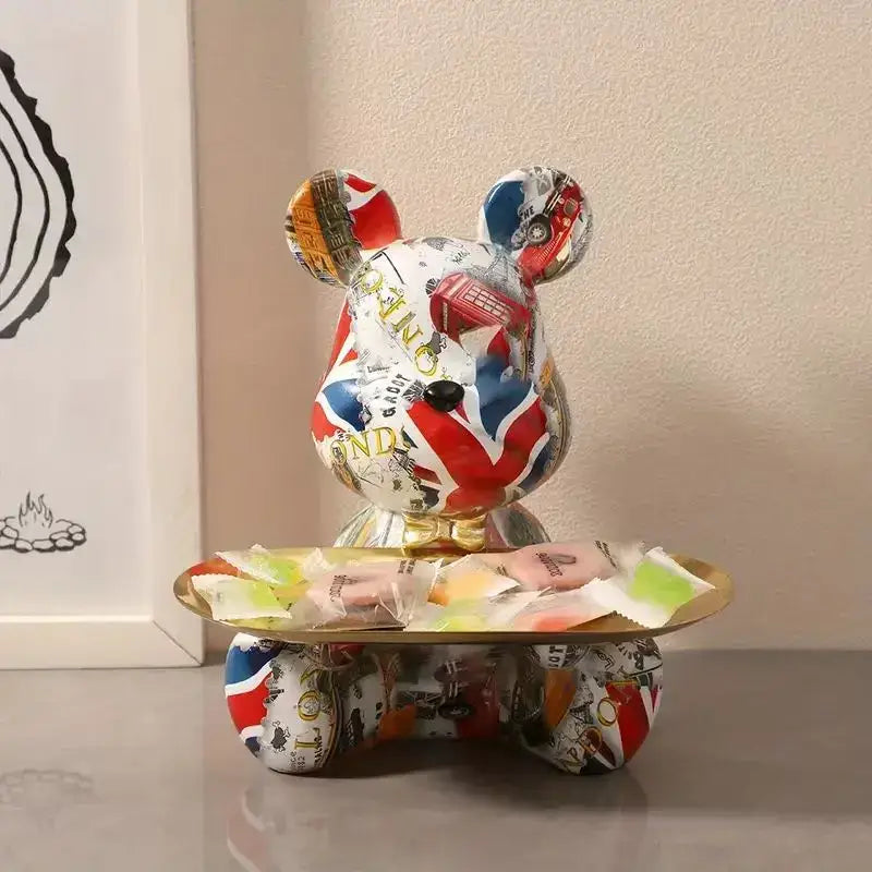 A colorful union jack and london-themed decorbites graffiti bear figurine on a gold skateboard tray for living room decor