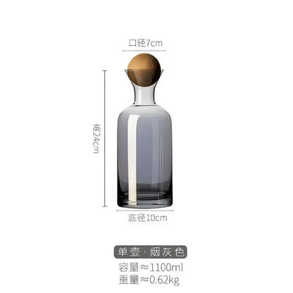 Modern gray amber glass water pitcher with a sleek smoke-gray decanter and rounded wooden stopper by decorbites gray amber