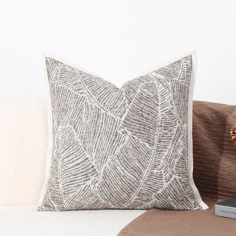 Modern gray and white leaf cushion cover with embroidered pattern and textured fabric for black white sofa decorbites decor