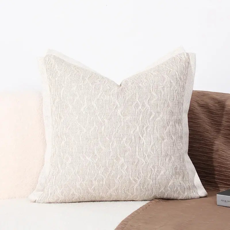 Beige textured cushion cover with subtle woven pattern and soft finish for modern gray and white leaf decorbites black white sofa