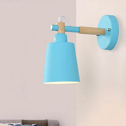 Modern gray and wood wall sconce light with blue matte finish lamp and wooden arm for bedroom use