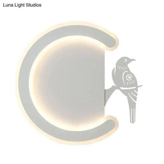 Modern gray wall lamp with a sleek curved frame and warm white light featuring a stylized bird silhouette