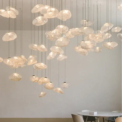 Modern gray cloud glass pendant lights with delicate translucent shades and soft glow hanging in living room decorbites cloud glass