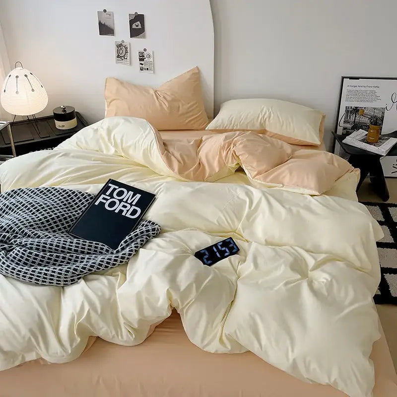 Cream-colored plush quilted comforter cover set with matching pillows and soft textured blanket for modern bedroom