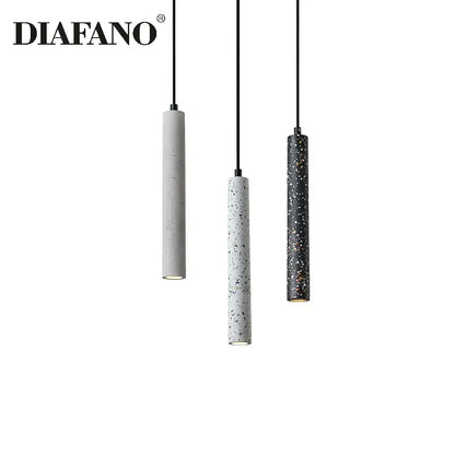 Modern gray concrete tube pendant light featuring three cylindrical speckled concrete shades in gray white and black for dining room decorbites concrete tube pendant chandelier