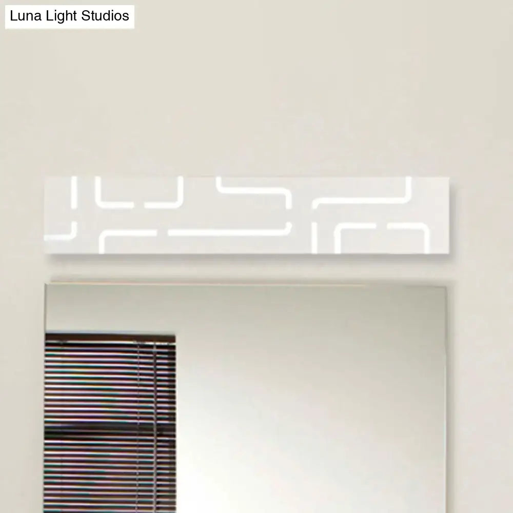 White rectangular bathroom mirror light with modern gray geometric pattern and warm white direct wired electric illumination