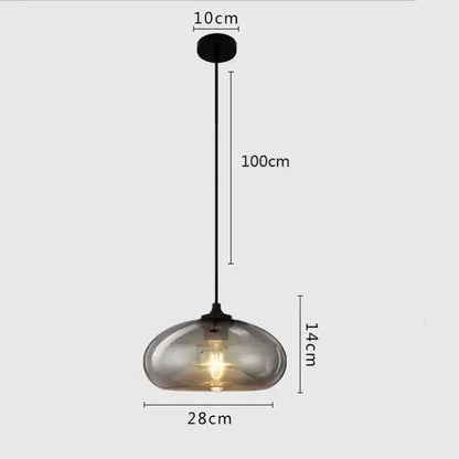 A sleek modern gray glass pendant light with smoked glass globe and black metal hardware for dining room lighting