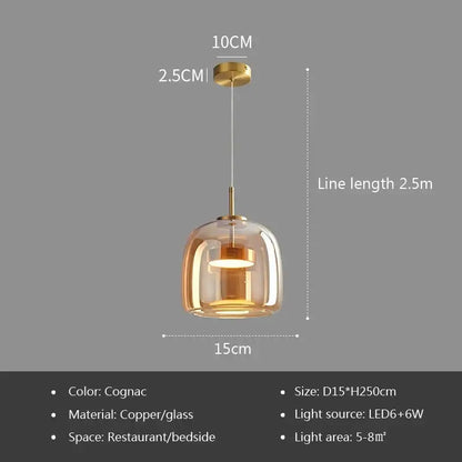 Modern gray glass pendant light with plated detailing featuring cognac-colored glass and copper finish for kitchen use