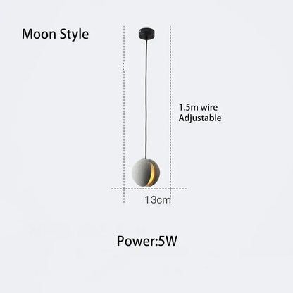 Modern gray and gold cement chandelier moon-style pendant light with golden crescent on sleek sphere by decorbites cement chandelier