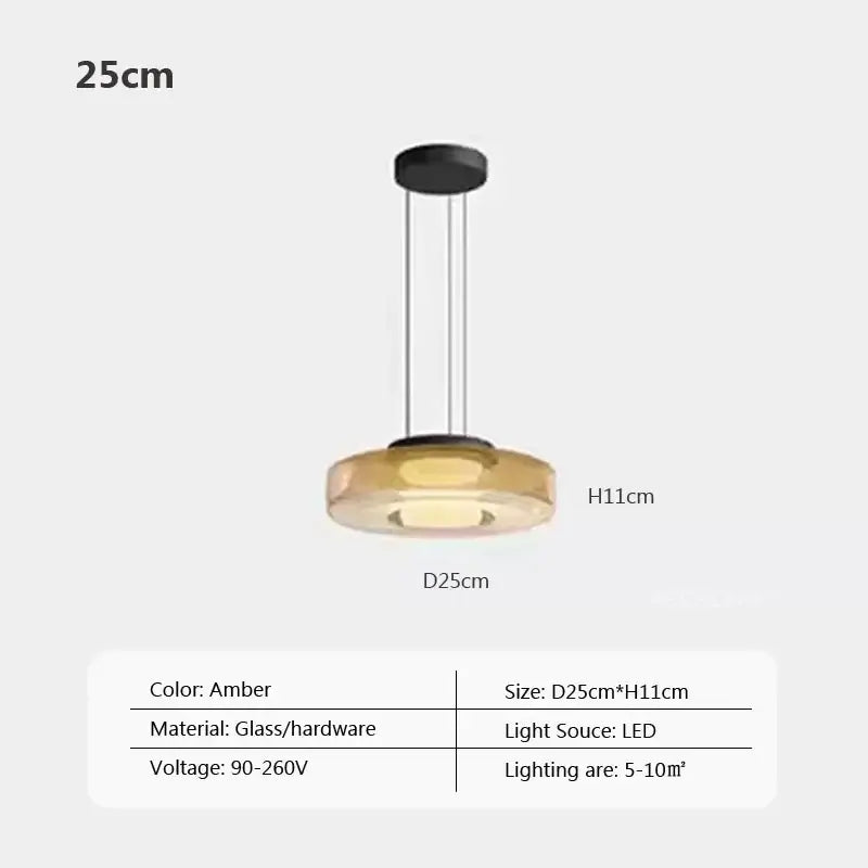 Modern gray and green tiered glass pendant light with amber glass and sleek black hardware for dining room use