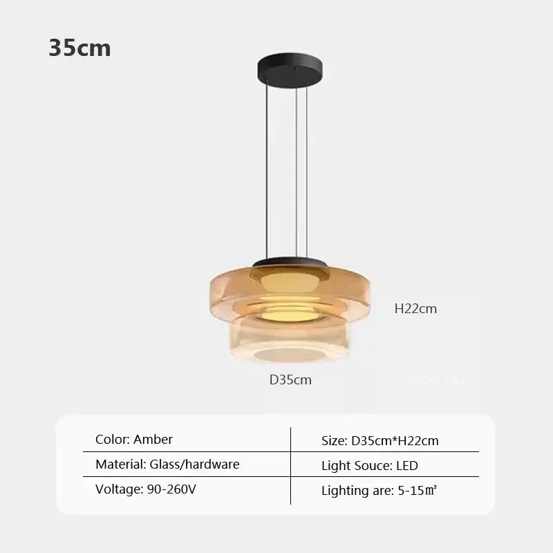 Modern gray and green tiered amber glass pendant light with black hardware and led lighting for dining room use