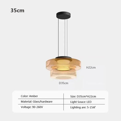 Modern gray and green tiered amber glass pendant light with black hardware and led lighting for dining room use