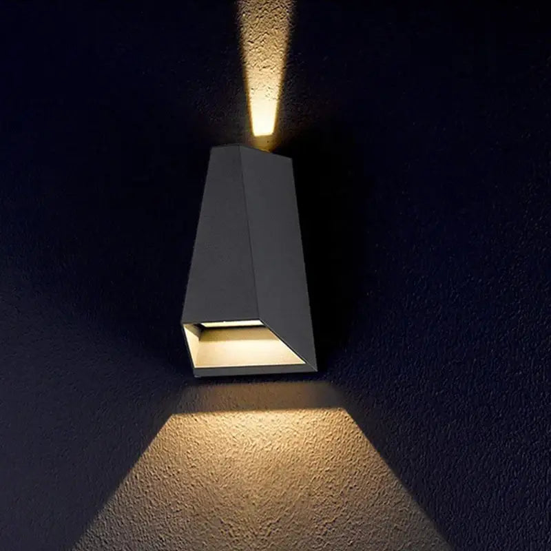 Modern gray metal led wall washer sconce with two angled light beams casting warm glow for garden and villa decorbites led wall