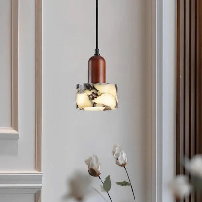 Modern gray marble natural stone pendant light with warm wood top and cord pendant installation for dining room