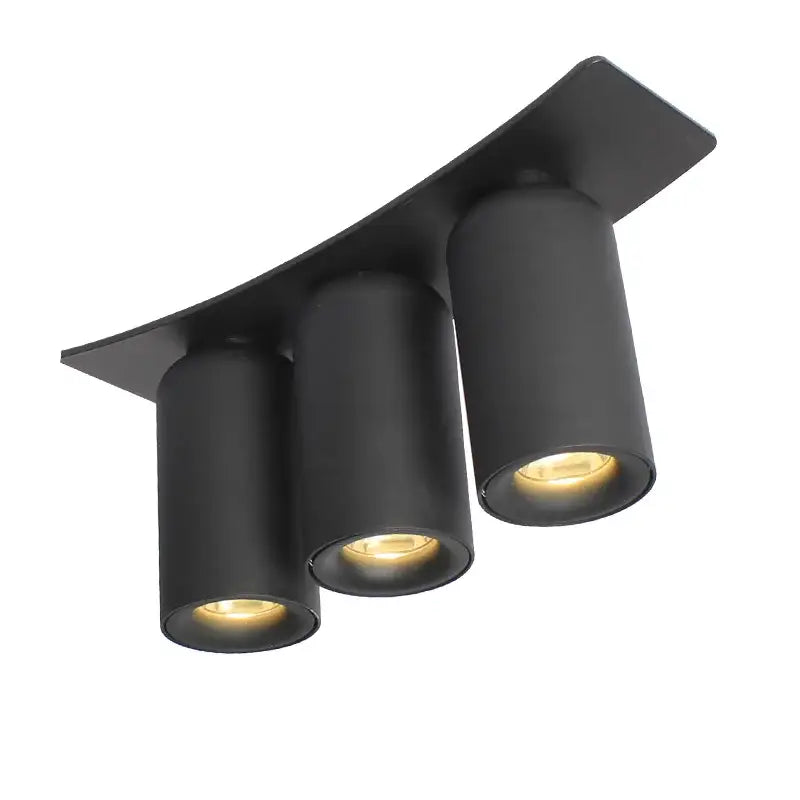 Modern gray minimalist sofa with wooden legs complemented by black matte decorbites led ceiling light emitting warm glow