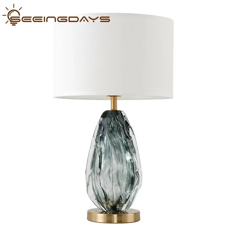 Modern gray swirl crystal table lamp with a teardrop glass base on a gold stand for bedroom decorbites crystal table use