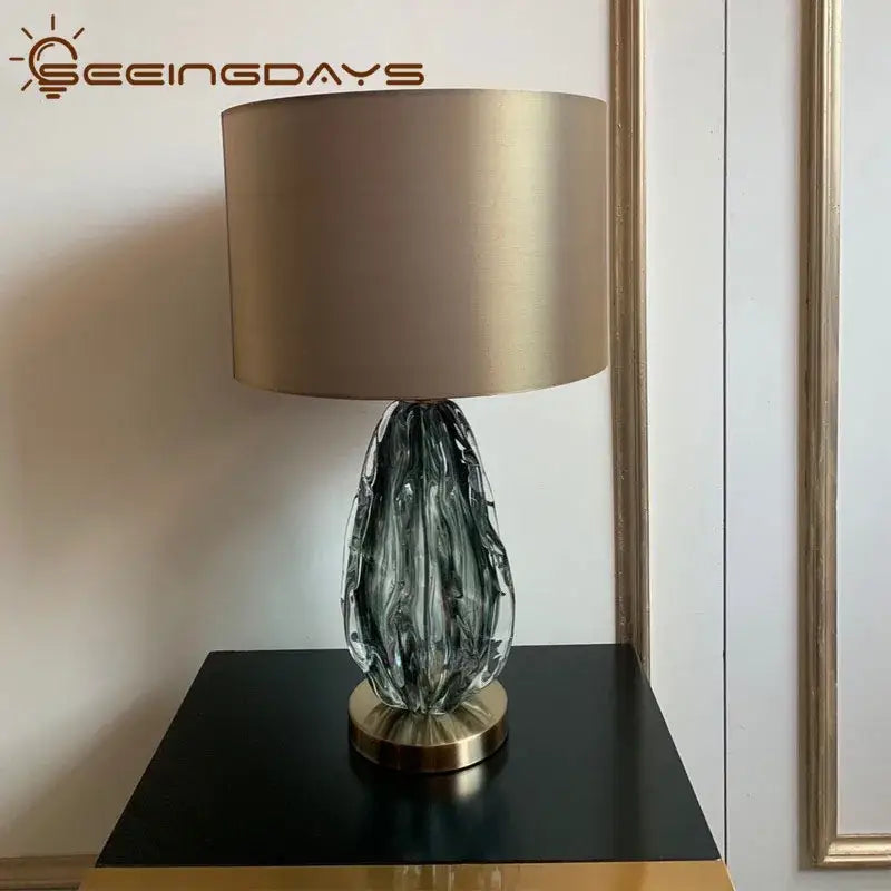 Modern gray swirl crystal table lamp with a dark gray textured glass body and gold-toned base for bedroom decorbites crystal table use