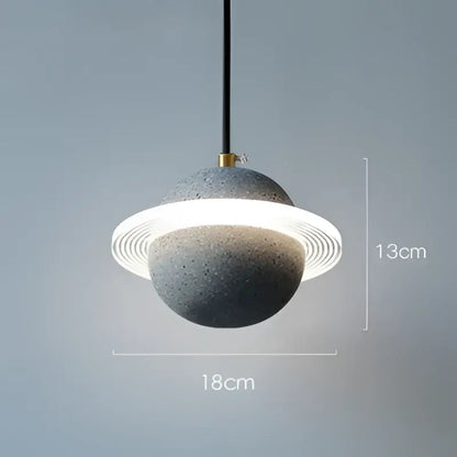 Modern gray and white cement planet pendant light featuring a textured concrete sphere and concentric rings for bedroom decorbites decor