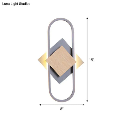 Modern gray and wood geometric led sconce with minimalist design emitting white light for bedroom lighting