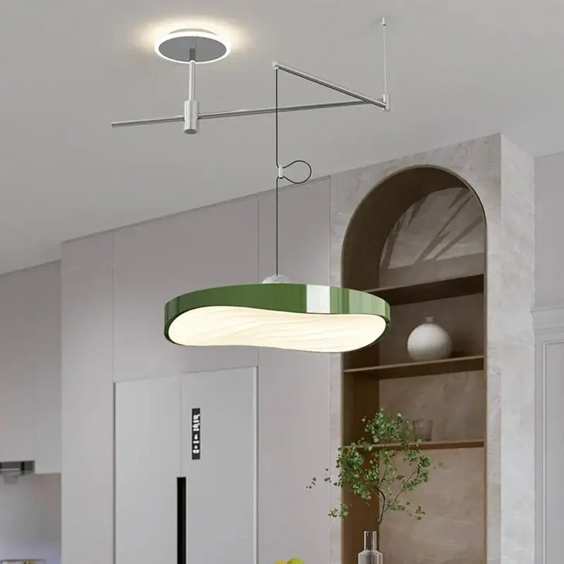 Modern green curved pendant light chandelier with sleek design and metallic arm for dining room lighting