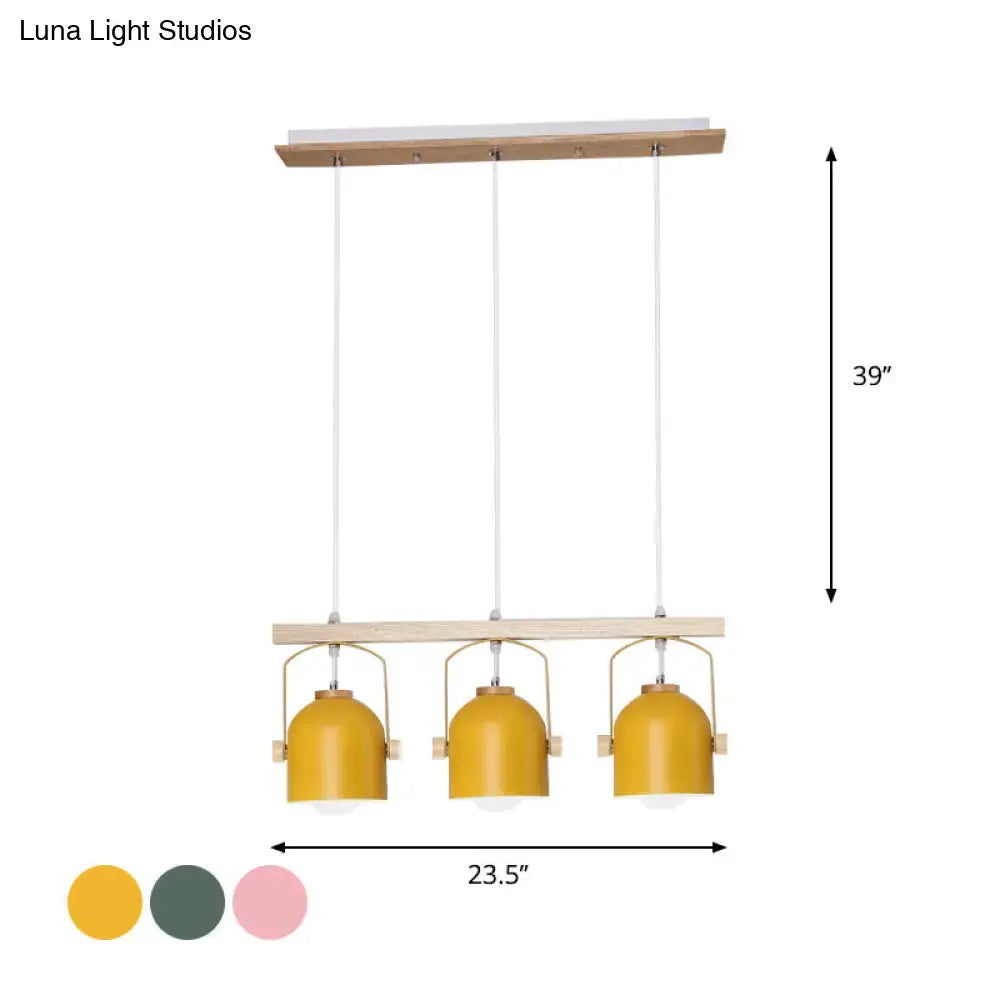 Decorbites nordic dome island light with three mustard-yellow metal shades hanging from a natural wood frame