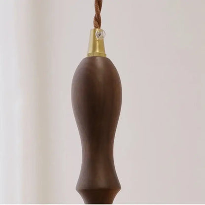 Dark brown wooden pull chain with brass cap and braided cord for modern green glass walnut wood pendant light dining room